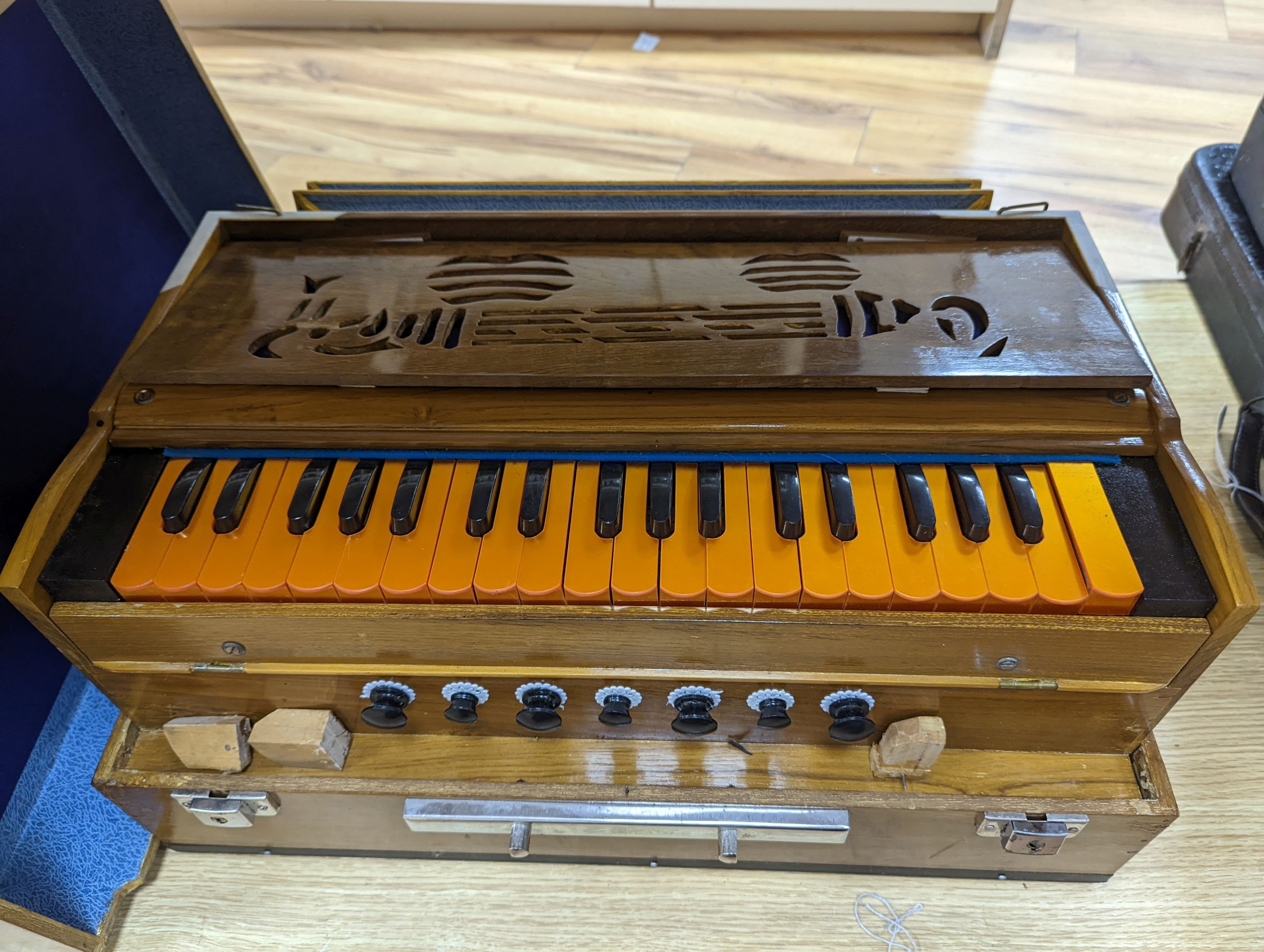 A hardwood cased harmonium